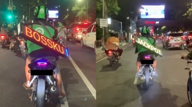 Viral Driver Ojol Gantung Running Text di Punggung. (TikTok)