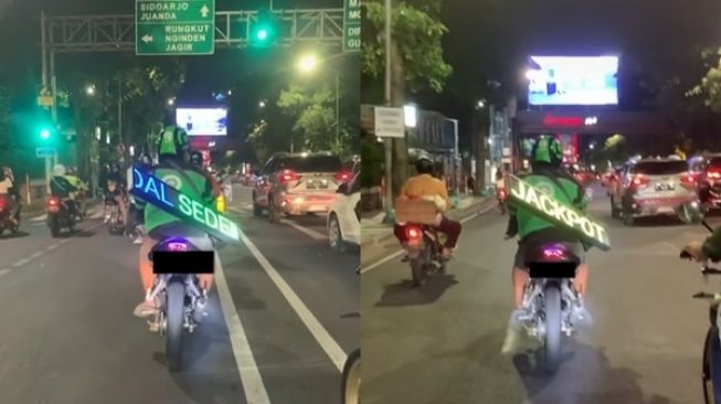 Viral Driver Ojol Gantung Running Text di Punggung. (TikTok)