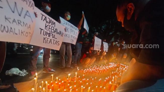 Lilin Dukungan untuk Polda Jatim Usut Tuntas Kasus Wali Kota Malang Diduga Melanggar PPKM