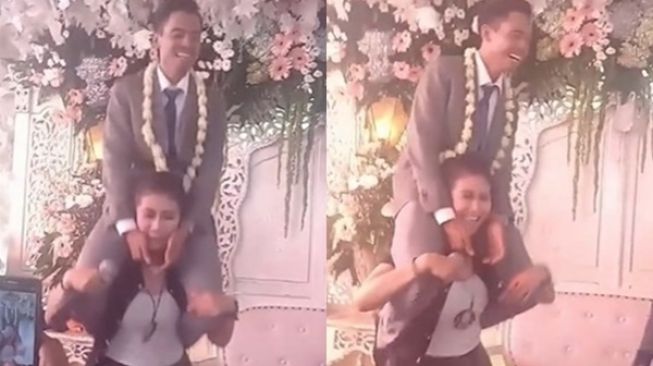 Datangi Pelaminan, Biduan Ini Malah Gendong Pengantin Pria, Respons Istrinya Disorot