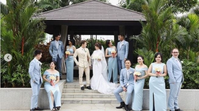Potret Pernikahan Pebulu Tangkis Indonesia. [Instagram/marcusfernaldig]
