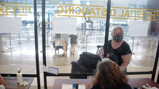 Suasana di terminal 3 Bandara Soekarno-Hatta, Tangerang, Banten. Sabtu (23/10).  [Suara.com/Hilal Rauda Fiqry]