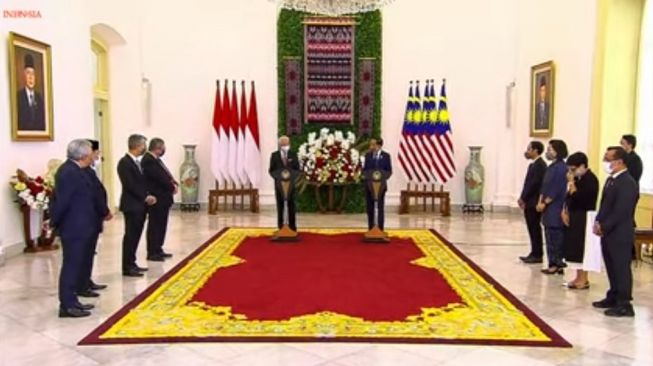 Kepada Jokowi, PM Ismail Sabri Jamin Perlindungan PMI di Malaysia
