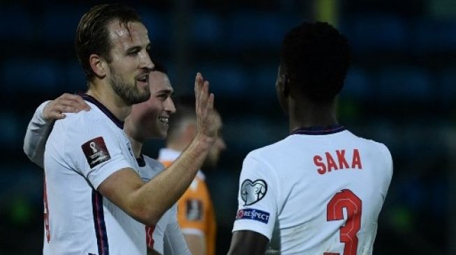 Striker Inggris Harry Kane merayakan golnya saat menghadapi San Marino di kualifikasi Piala Dunia 2022 Grup I zona Eropa di Olympic stadium, Serravalle, San Marino. Filippo MONTEFORTE / AFP