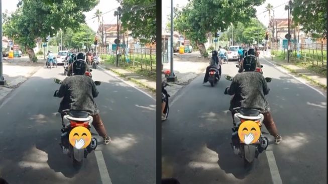 Pemotor berteduhsaat menunggu lampu merah bikin kesal sopir (TikTok)