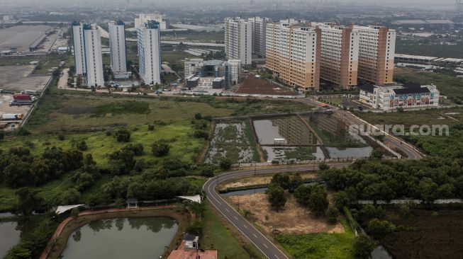 Foto udara Rumah Susun Nagrak di Cilincing, Jakarta, Senin (20/12/2021). [Suara.com/Angga Budhiyanto]