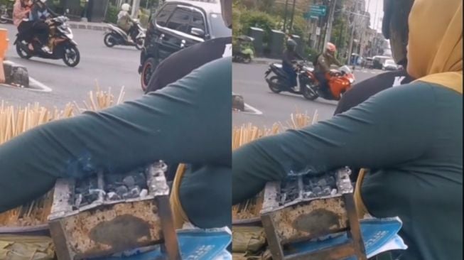 Tahan Panas di Lampu Merah, Emak-Emak Pangku Pemanggang Sate dengan Api Menyala