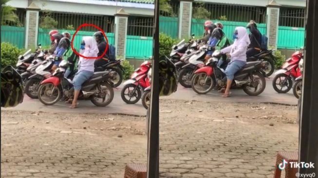 Kocak! Cewek Ini Memakai Hijab di Luar Helm, Warganet: Ciput Anti Badai