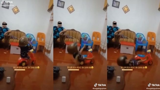 Bocah terjengkang karena memakai helm terlalu besar. (TikTok/@sugabiguyhaw)