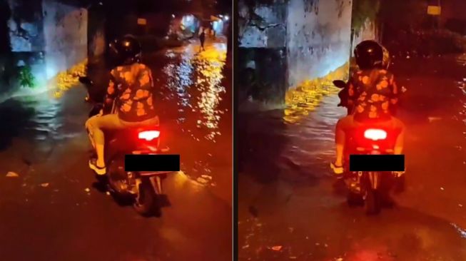 Nekat Terjang Banjir, Sejoli Pemotor ini Berakhir Terjebak Sampai Mesin Ngebul, Warganet: Ngeyel Angel Kandani