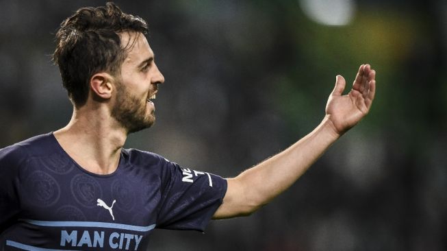 Gelandang serang Manchester City, Bernardo Silva tampil pada laga babak 16 besar Liga Champions kontra Sporting CP di Lisbon, Portugal, Rabu (16/2/2022) dini hari WIB. [PATRICIA DE MELO MOREIRA / AFP]