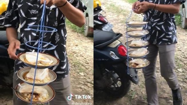 Makan di Hajatan Model Piring Terbang, Cara Pria Ini Antar Piring ke Tamu Jadi Sorotan (TikTok/degisupro)