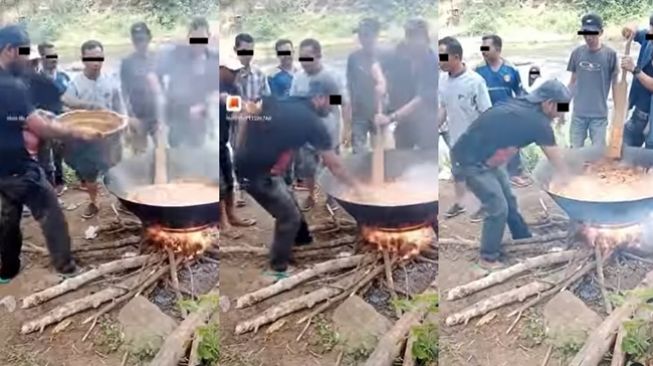 Pria santai aduk masakan di atas wajan panas dengan tangan telanjang. (Instagram/@fakta.indo)