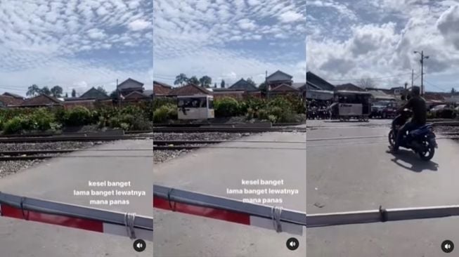 Pemotor menunggu lama di palang perlintasan kereta api, yang lewat malah lori. (Instagram/@dramaojol.id)