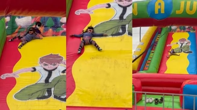 Kakak seret dan paksa adiknya main perosotan di istana balon. (Instagram/@ngakaksehat)