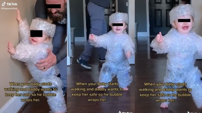 Ayah lilitkan bubble wrap ke tubuh anaknya yang baru belajar berjalan. (TikTok/@theparenttok)