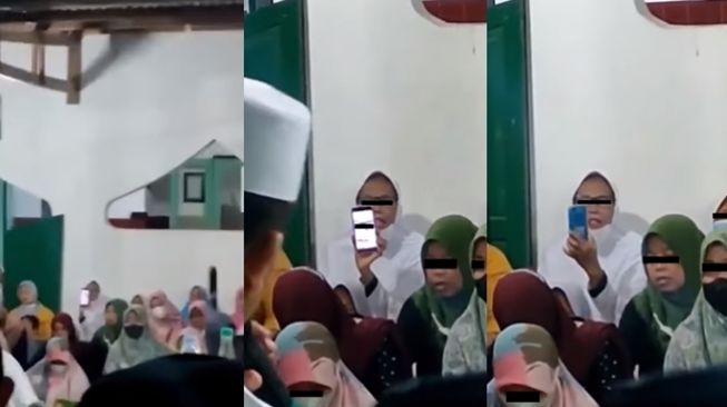 Ibu-ibu terbalik mengarahkan kamera saat merekam ustaz di pengajian. (Instagram/@ngakaksehat)