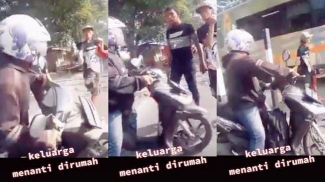 Aksi petugas perlintasan hentikan pemotor bandel ingin menyebrang saat kereta api hampir lewat (TikTok manto12jambi)