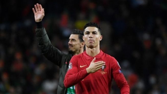 Reaksi pemain depan Portugal Cristiano Ronaldo pada akhir pertandingan sepak bola kualifikasi Piala Dunia 2022 antara Portugal dan Makedonia Utara di stadion Dragao di Porto pada 29 Maret 2022.MIGUEL RIOPA / AFP