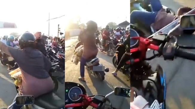 Emak-emak nekat angkat palang kereta dan berakhir terjungkal. (Twitter/@jowoshitpost)