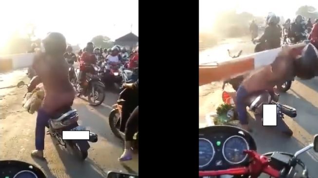 Emak-emak naik Suzuki Shogun langsung kena karma instan saat nyelonong palang pintu kereta api (Twitter)