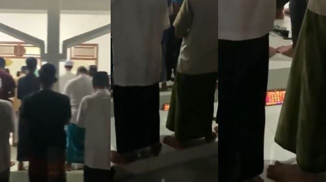 Cowok terekam salat berjemaah sambil main judi slot. (Twitter/@jowoshitpost)