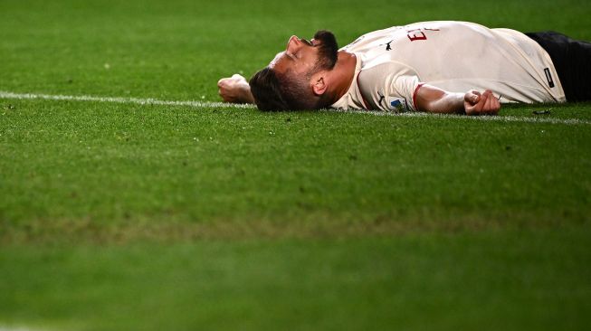 Pemain depan AC Milan Olivier Giroud bereaksi selama pertandingan sepak bola Serie A Italia antara Torino melawan AC Milan di Stadion Olimpiade di Turin, Senin (11/4) dini hari WIB.  MARCO BERTORELLO / AFP