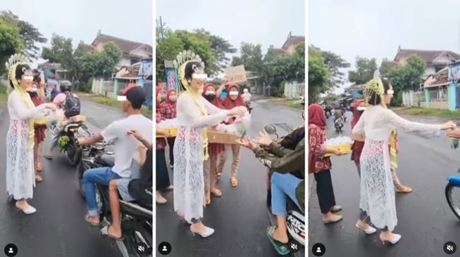 Antimainstream! Masih Pakai Kebaya Lengkap, Pengantin Perempuan Terciduk Bagi-bagi Takjil di Pinggir Jalan