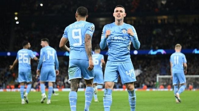 Gelandang Manchester City Phil Foden merayakan golnya pada pertandingan sepak bola leg pertama semifinal Liga Champions UEFA antara Manchester City dan Real Madrid, di Stadion Etihad, di Manchester, pada 26 April 2022.Oli Scarf / AFP