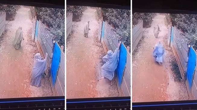 Viral wanita bercadar terekam CCTV iseng menekan bel rumah orang lalu langsung lari kabur dari lokasi kejadian. (Instagram/@say.viideo)