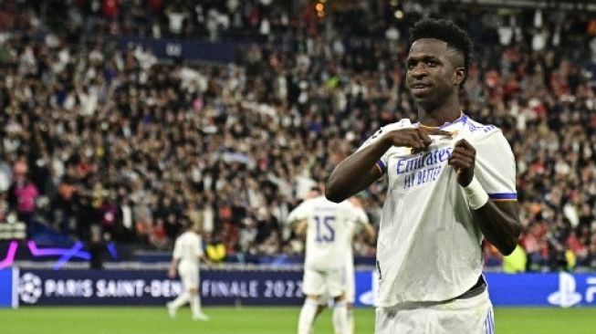 Pemain depan Real Madrid Brasil Vinicius Junior merayakan golnya di pertandingan sepak bola final Liga Champions UEFA antara Liverpool dan Real Madrid di Stade de France di Saint-Denis, Paris, pada 28 Mei 2022. JAVIER SORIANO / AFP