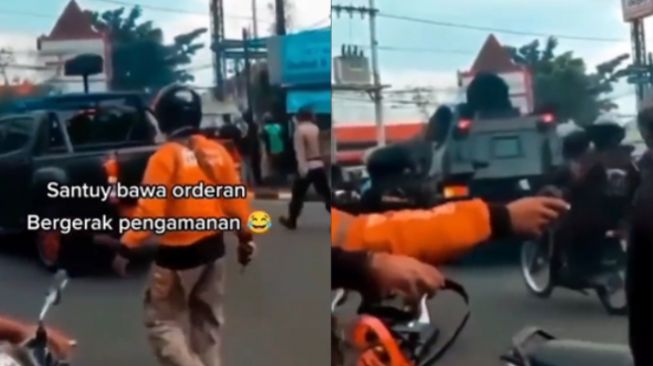 Rombongan Polisi Lewat, Warganet Salfok Kurir Shopee Food Bawa HT