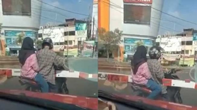 Nekat Menerobos, Pemotor Muda-mudi Malah Tersangkut Kejebak di Palang Kereta Api