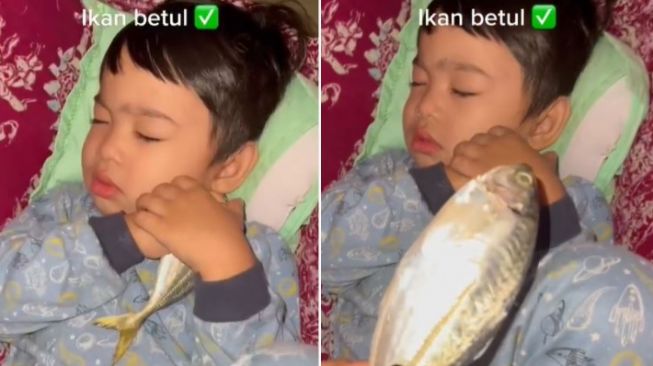 Unik Banget, Bocah Ini Suka Tidur Sambil Peluk Ikan Asli