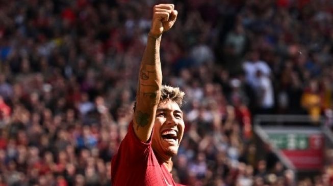 Striker Liverpool Roberto Firmino merayakan golnya pada pertandingan sepak bola Liga Premier Inggris antara Liverpool dan Bournemouth di Anfield di Liverpool, barat laut Inggris pada 27 Agustus 2022.Oli SCARFF / AFP