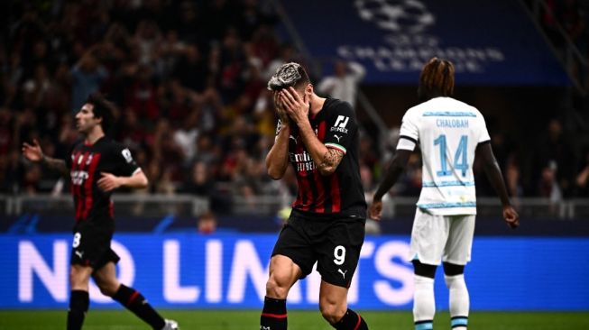 Reaksi penyerang AC Milan Olivier Giroud selama matchday keempat Grup E Liga Champions antara AC Milan vs Chelsea, di stadion San Siro, di Milan, pada 11 Oktober 2022.Marco BERTORELLO / AFP.