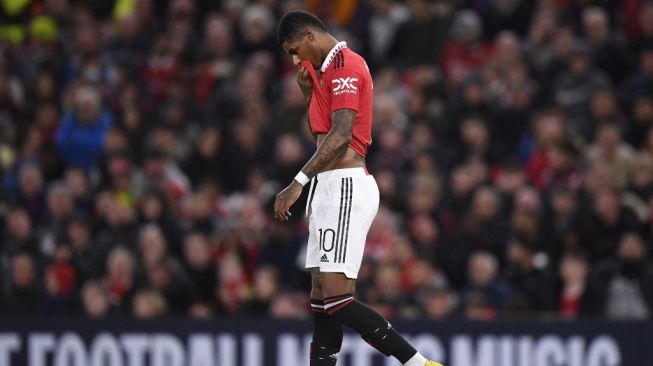 Ekspresi penyerang Manchester United, Marcus Rashford pada laga Liga Europa kontra Omonia Nicosia di Old Trafford, Manchester, Jumat (14/10/2022) dini hari WIB. [Oli SCARFF / AFP]