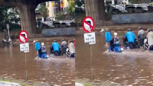 Lewati Pengendara Motor Mogok, Pengemudi Vespa Ini Santai Lewati Banjir