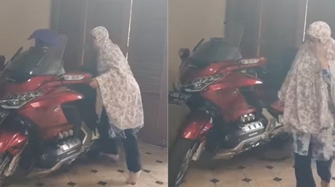 Ibu-ibu Ini dengan Enteng Parkirkan Moge Suaminya Pakai Standar Tengah, Kekuatannya Bikin Warganet Melongo