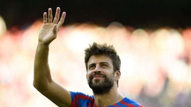 Bek Barcelona Spanyol Gerard Pique pemanasan dimulainya pertandingan sepak bola leg pertama Grup C Liga Champions UEFA antara FC Barcelona dan Viktoria Plzen, di stadion Camp Nou di Barcelona pada 7 September 2022. Pau BARRENA / AFP