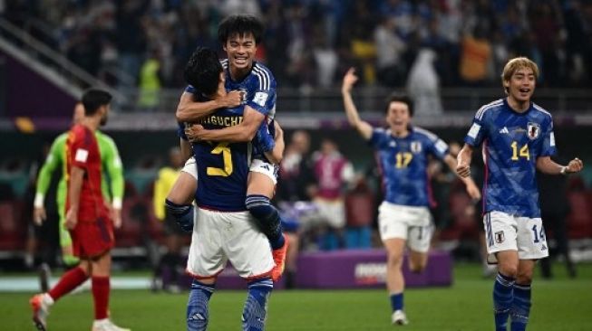 Reaksi para pemain Jepang setelah pertandingan sepak bola Grup E Piala Dunia Qatar 2022 antara Jepang dan Spanyol di Stadion Internasional Khalifa di Doha pada 1 Desember 2022.Anne-Christine POUJOULAT / AFP
