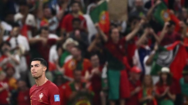 Penyerang Timnas Portugal #07 Cristiano Ronaldo melakukan selebrasi setelah timnya memenangkan pertandingan babak 16 besar Piala Dunia 2022 antara Portugal vs Swiss di Stadion Lusail di Lusail, utara Doha pada 6 Desember 2022.Fabrice COFFRINI / AFP.