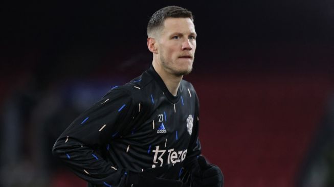 Striker Manchester United, Wout Weghorst melakoni pemanasan jelang laga Liga Inggris kontra Crystal Palace di Selhurst Park, London, Kamis (19/1/2023) dini hari WIB. [ADRIAN DENNIS / AFP]