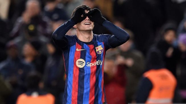 Gelandang Barcelona Pedri Gonzalez merayakan gol yang dicetaknya ke gawang Getafe, dalam laga Liga Spanyol yang berlangsung di Stadion Camp Nou, Barcelona, ​​Minggu (22/1/2023).  (ANTARA/AFP/JOSEP LAGO)