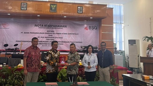 Penandatanganan nota kesepahaman (Memorandum of Understanding/MoU) di Kantor Pusat Bank SulutGo, Manado, Sulawesi Utara, pada Jumat, (20/1/2023). (Dok: Pos Indonesia)