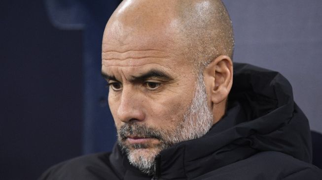 Manajer Manchester City, Pep Guardiola. [OLI SCARFF / AFP]