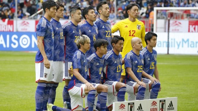 Para pemain Timnas Jepang. [NORBERT SCHMIDT / AFP]