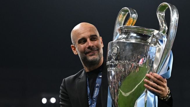 Manajer Manchester City, Pep Guardiola usai membawa timnya juara Liga Champions 2022/2023. [Paul ELLIS / AFP]