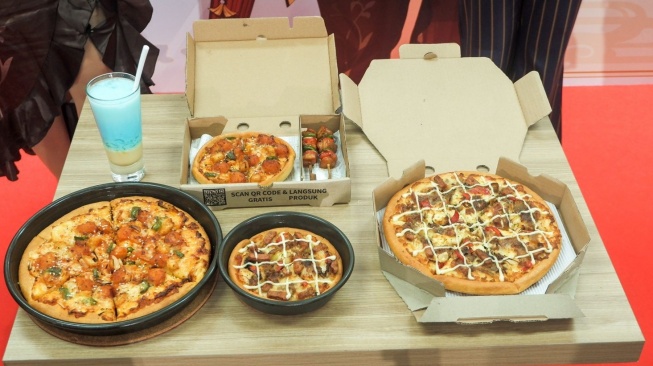 Menu spesial kolaborasi Pizza Hut x Genshin Impact. (Foto: Suara.com/Ririn Indriani)