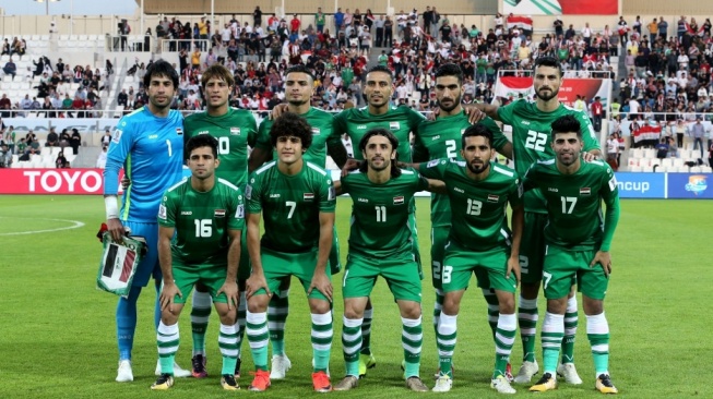 Timnas Irak berbaris untuk sesi foto selama pertandingan grup D Piala Asia 2019 antara Yaman vs Irak di stadion Sharjah di Sharjah pada 12 Januari, 2019.Karim SAHIB / AFP.